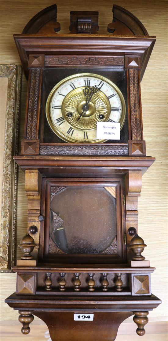 A late Victorian walnut eight day wall clock